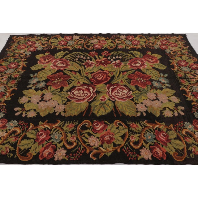 Handwoven in wool and originating circa 1950-1960, this gorgeous 7x8 vintage Bessarabian Kilim is a particularly special...