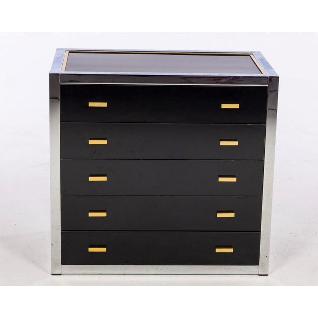 Designed by Renato Zevi in the late 1970s- early 1980’s. The chest consists of a brass and chrome framing and black...