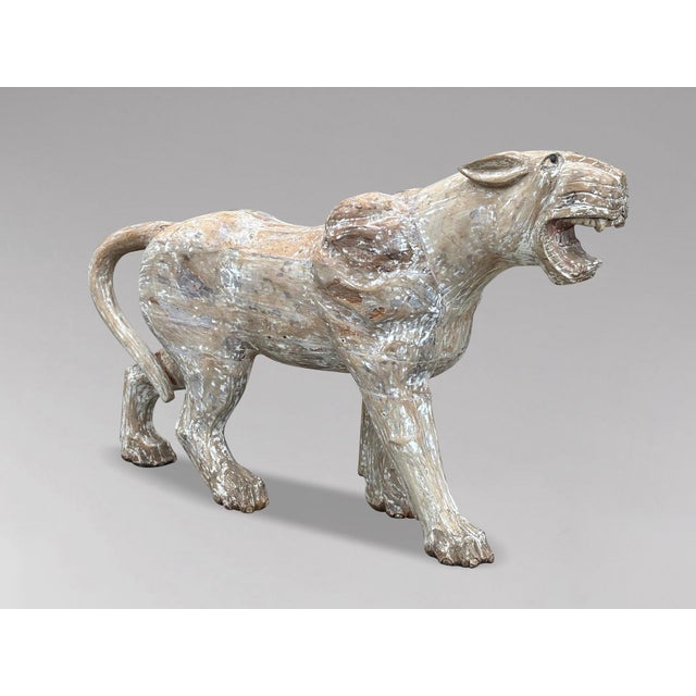 This large mid-20th century hand-carved wooden carousel panther statue features an open mouth and glass eyes. Originally...