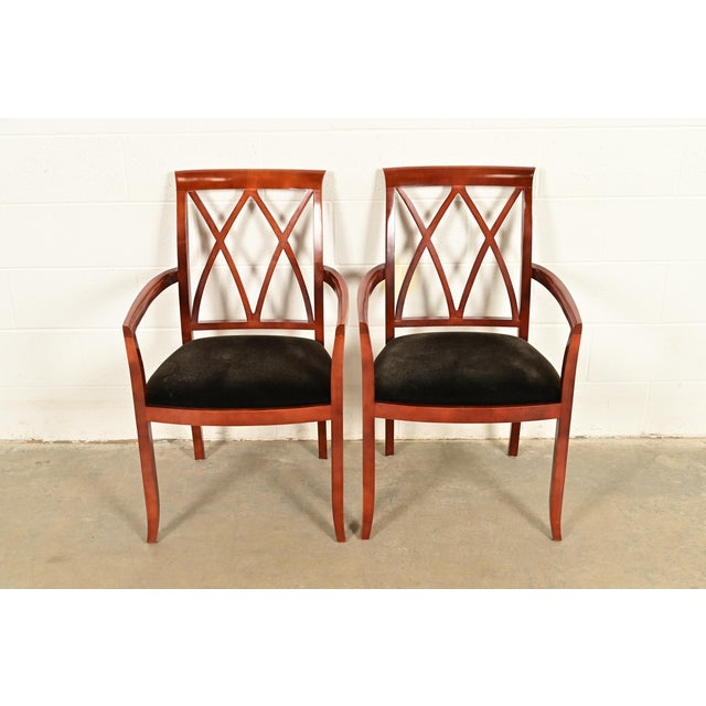 An outstanding pair of Regency or Neoclassical style armchairs or dining captain chairs By Bernhardt USA, Circa Late 20th...