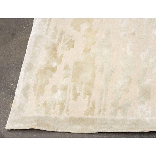 Edward Fields "Cloud Cover" Wool and Silk Carpet, in light gray, label to underside. 15' L x 9' W. Provenance: From an...