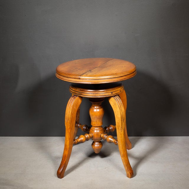 ABOUT An antique solid oak piano stool with adjustable seat and cast iron swivel mechanism. CREATOR Unknown. DATE OF...
