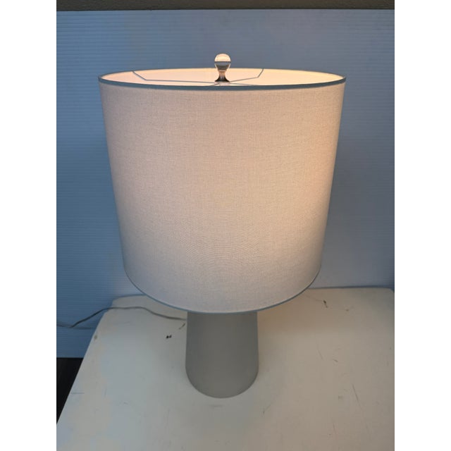 Design Plus Gallery presents the Christie Table Lamp from FlowDecor. This table lamp boasts a frosted finish on its mouth-...