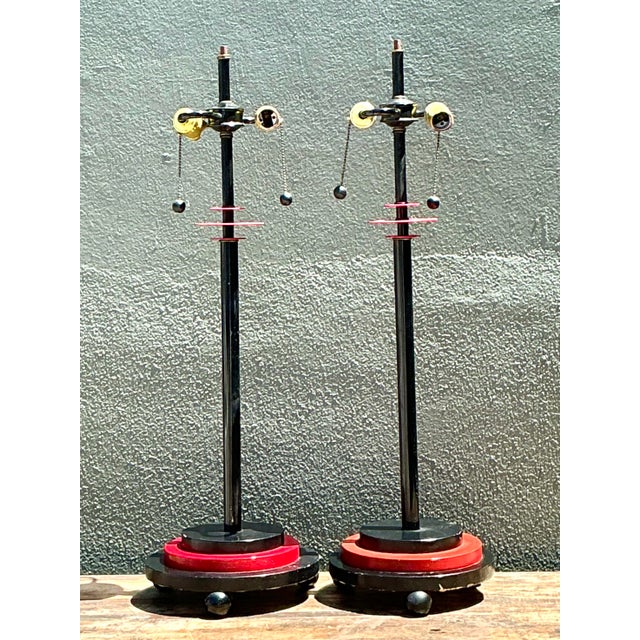 This striking pair of vintage postmodern table lamps features a sophisticated architectural silhouette that commands...