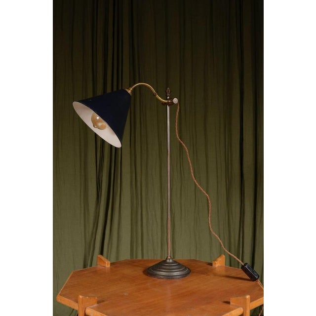 A very smart fully adjustable French rise and fall desk lamp, with knobs to adjust the height and the tilt, with a blue...