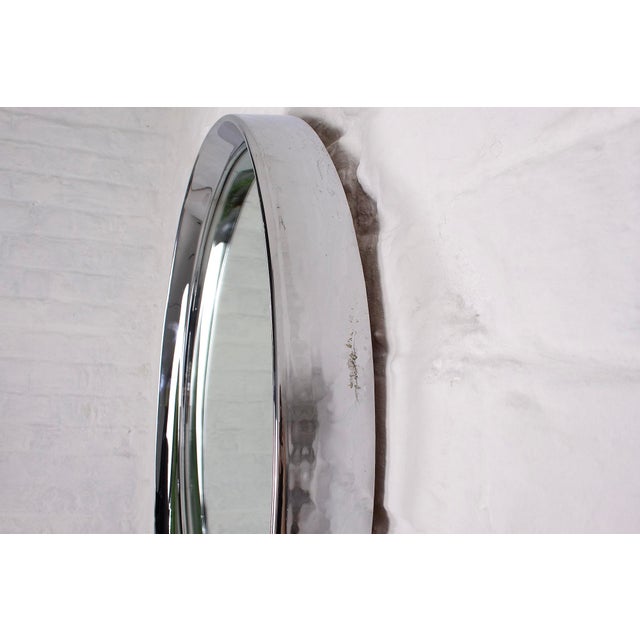 1970s: Round chrome-plated steel mirror Diameter 56 cm x Depth 6 cm. Mirror diameter only 45 cm. Slight oxidation in a...