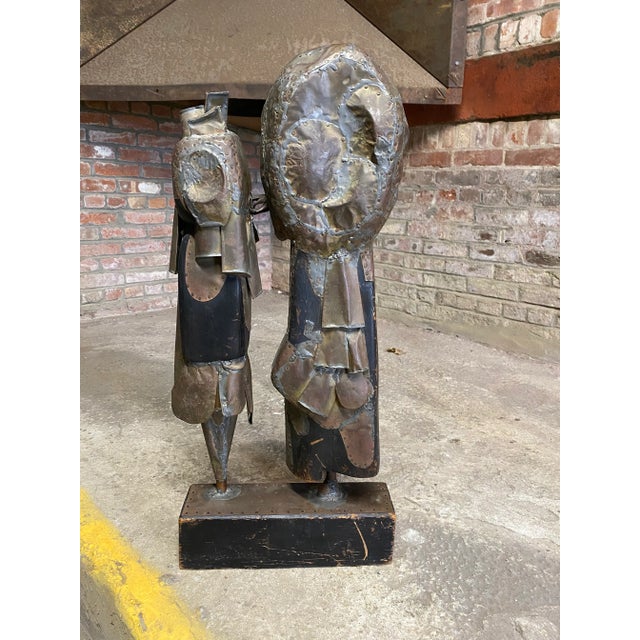Amazing mixed metals and wood Brutalist Period couple sculpture. A wonderful mix of copper, brass, nails and wood that...