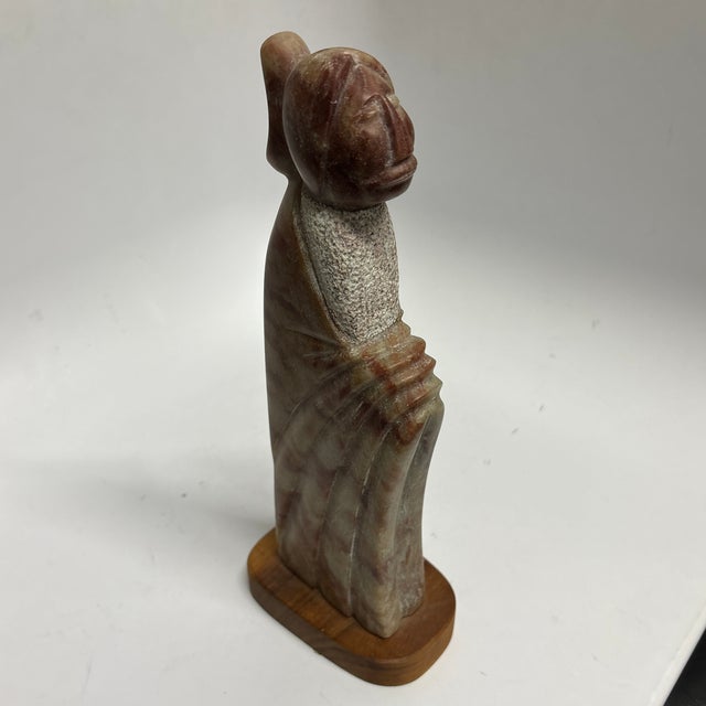 Beautiful Signed Ned Archuleta Sculpture. Expertly carved from soapstone, the sculpture features a Native American woman...