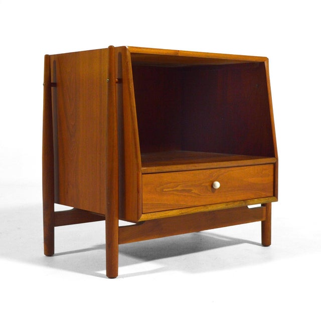This beautifully detailed nightstand in walnut by Kipp Stewart & Stewart MacDougall for their "Declaration" line by Drexel...