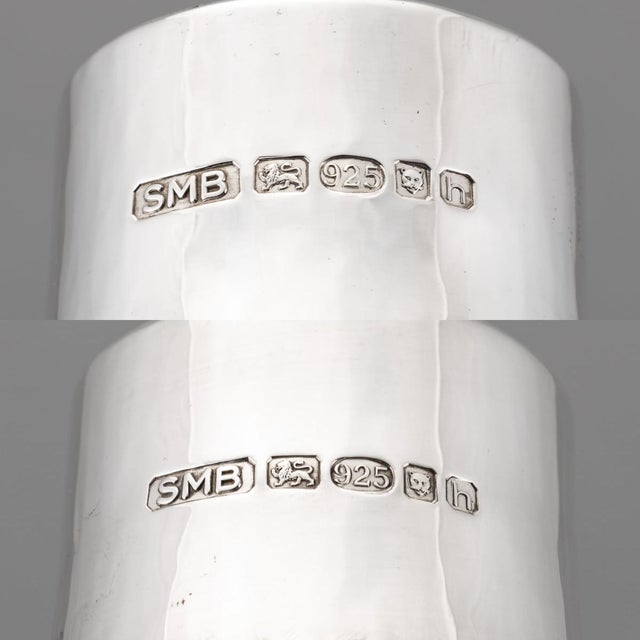 An elegant pair of silver-mounted decanters, hallmarked for london 2007, showcasing a beautiful fusion of traditional...