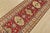 A traditional tribal Caucasian Kazak runner hand-knotted with fine wool on a cotton foundation. This rug features...