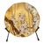 Beautiful coordinating set of four floral glass plates featuring Japanese-inspired botanical designs against warm gold-...