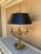 A gorgeous English Regency style solid brass bouillotte lamp with black tole shade By Visual Comfort USA, Late 20th...