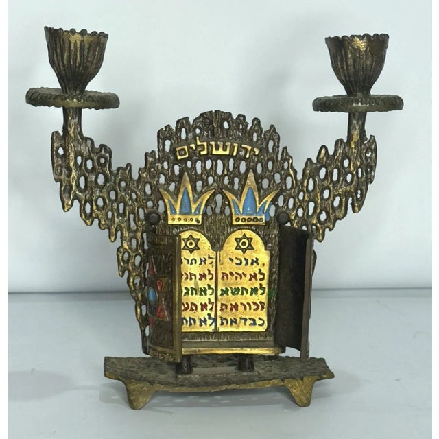 Fantastic Israeli brass Shabbat candle holder by Hen Holon Dayagi. Features two shaped candle holders over a brutalist...