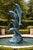 A striking and architecturally scaled American bronze fountain sculpture featuring four dynamically modeled dolphins...