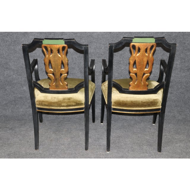 Elevate your dining or entertaining space with this exceptional set of 8 fine quality ebonized and gilded neoclassical...