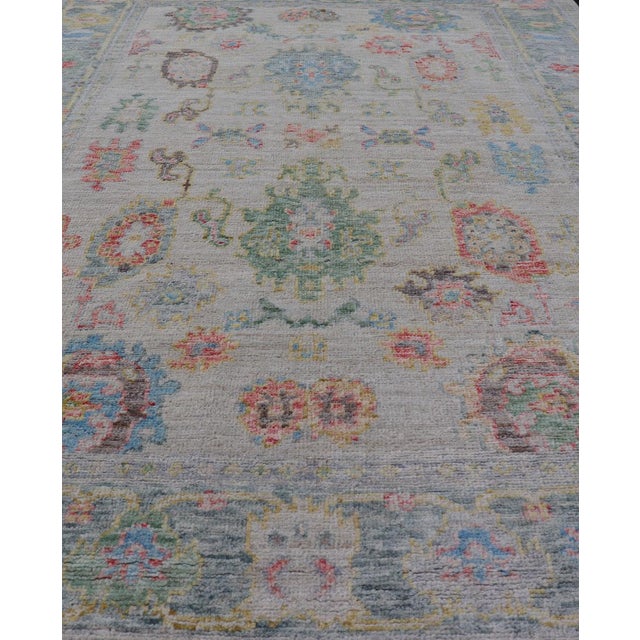 Early 21st Century Modern All-Over Floral Oushak With Muted Background and Accent Colors For Sale - Image 5 of 10