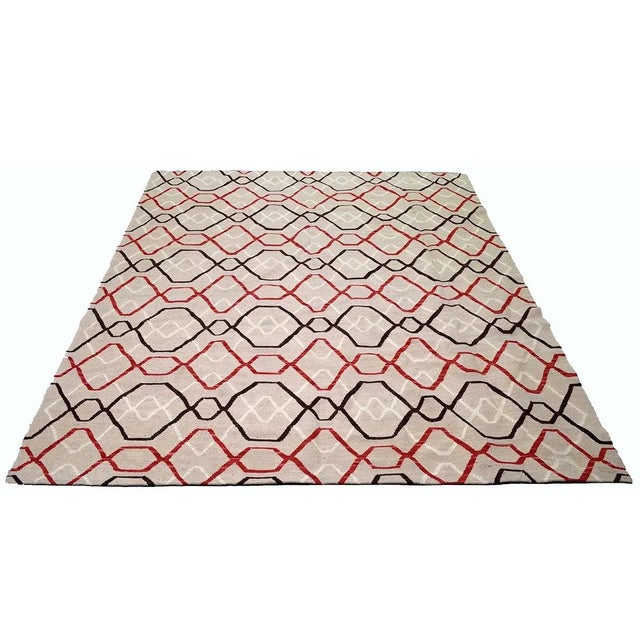 Hand-knotted with care using traditional rug making techniques, this wool rug blends timeless craftsmanship with a modern...