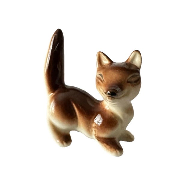 Vintage mid 20th century fox figurine. Approximately 2” x 2”.