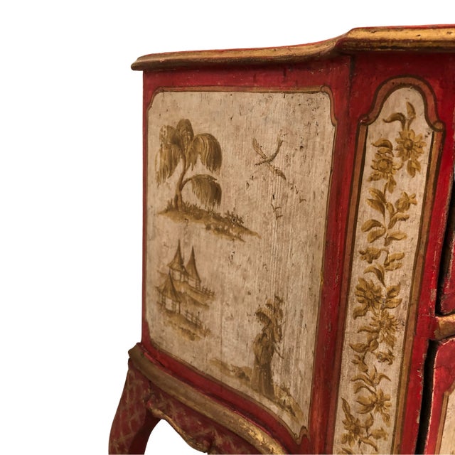 An 18th-century French commode in the Chinoiserie style, dating from the Louis XV period. It features curved lines, a...