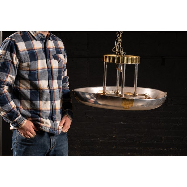 Art deco ceiling light fixture, constructed of aluminum. This light fixture is hardwired and hangs 13" down from its...