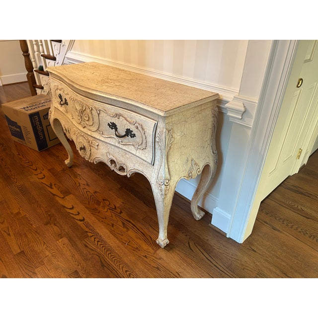 Traditional solid wood credenza with antiqued crackled white finish.