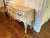 Traditional solid wood credenza with antiqued crackled white finish.