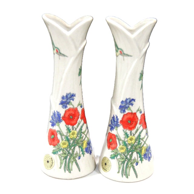 Pair of 1981 Takahashi bud vases with original labels intact. The design features beautiful flowers and hummingbirds. In...
