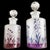 A pristine antique Art Nouveau Moser crystal perfume bottle set with floral, burnt enamel decoration, circa 1890. This...