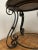 Antique wrought iron center table with round black marble top. Marble top is removable for shipping.
