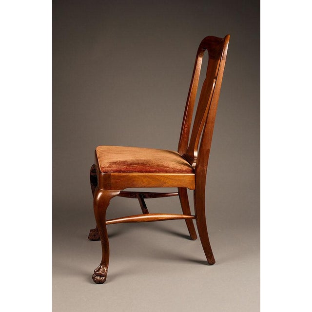 A classic set of eight antique mahogany Queen Anne Style dining chairs dating to circa 1900. Crafted from mahogany, these...