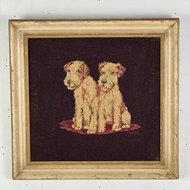 What more can we say than the title? A lovely vintage framed needlepoint of two Charming terriers on a mat. Ok, the frame...