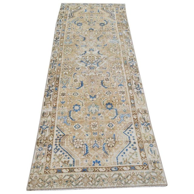 Hand-knotted with care using traditional rug-making techniques, this wool rug blends timeless craftsmanship with a modern...