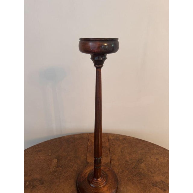 Antique mahogany smokers stand, having a antique mahogany smokers stand with a circular shaped base a slender stand with a...
