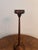 Antique mahogany smokers stand, having a antique mahogany smokers stand with a circular shaped base a slender stand with a...