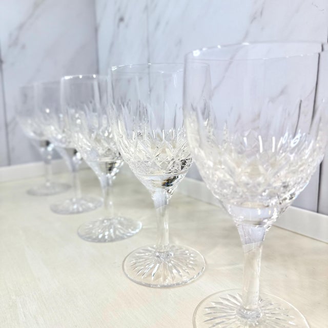 Five water goblets cut by Stuart Crystal of Stourbridge in the “Glencoe” pattern. Each stands about 6⅞ inches (17 cm) tall...