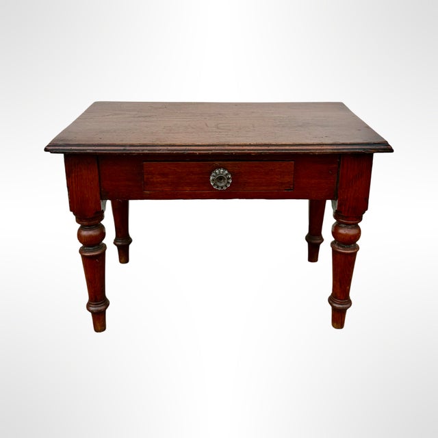 antique English Sample table handcrafted from high-quality pine wood. The table has a simple yet elegant rectangular shape...