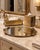 Elegant vintage three-piece bathroom or vanity set by Stylebuilt, featuring an ornate gilt finish with twisted-rope...