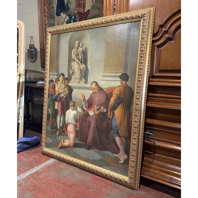 Painted in Italy circa 1890, this large antique oil on canvas depicts a solemn moment of religious devotion within a grand...