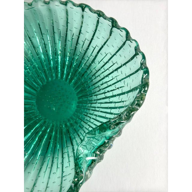This decorative Murano glass bowl was produced in Italy around the 1960s by Barovier & Toso and is crafted from...