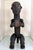 Carved out of a single block of wood, this Gabon Fang male reliquary statue of stylized proportion impresses the viewers...