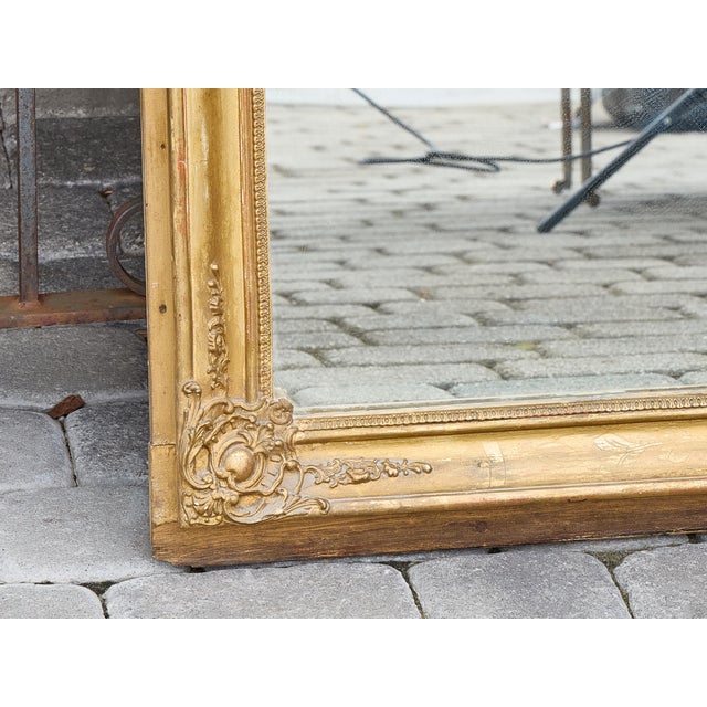 This tall English trumeau mirror combines the narrative charm of a 19th-century countryside hunting scene with the...