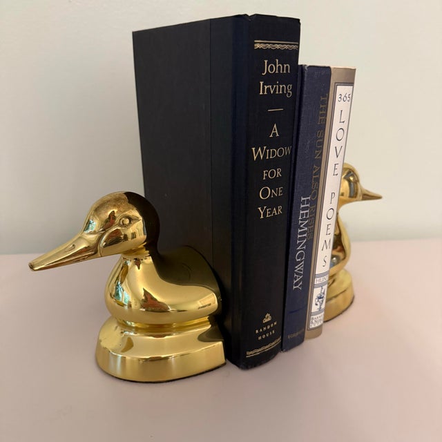 Vintage Solid Brass Duck Bookends — Elegant pair of vintage solid brass duck head bookends with a bright polished finish...