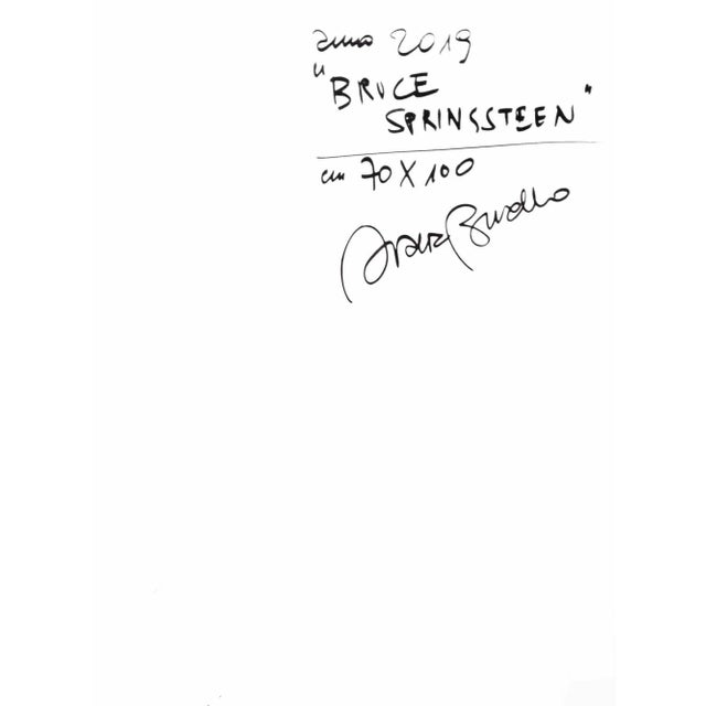 Amazing unique piece framed with thin black lacquered slat depicting the famous rock star Bruce Springsteen playing his...