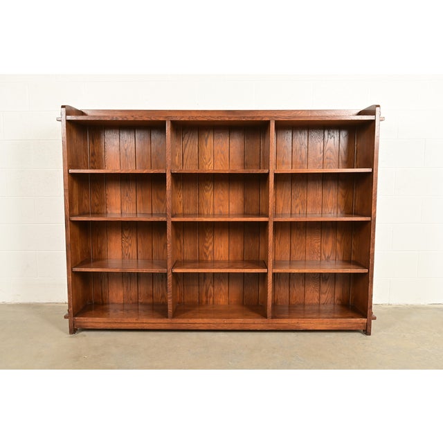 A beautiful Mission or Arts & Crafts solid oak triple bookcase By L. & J.G. Stickley USA, 1998 Measures: 76.25"W x 12"D x...