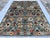 This artistic hand-knotted wool area rug features a stunning and vibrant Suzani tribal design. The main field is decorated...