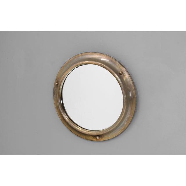 Circular brass framed " Porthole Mirror ". France circa 1930.