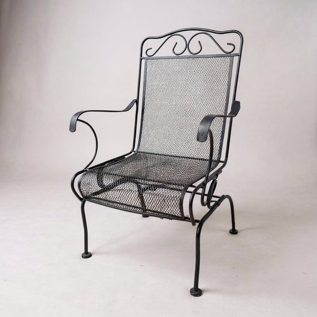 These 1990s Meadowcraft metal mesh spring coiled rocking armchairs are made from heavy-gauge, rust-resistant wrought iron...