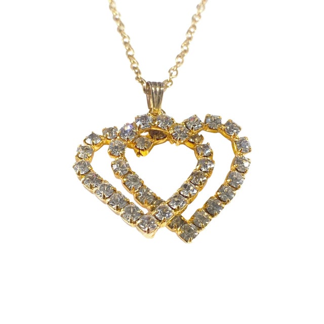 Superb &nbsp;Gold Tone and dazzling Rhinestone, this Hanging Hearts Pendant Charm Chain Necklace by "Jewels by Rio "is...