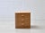 A beautifully designed vintage nightstand with three spacious drawers and a warm, light wood finish. The clean, compact...